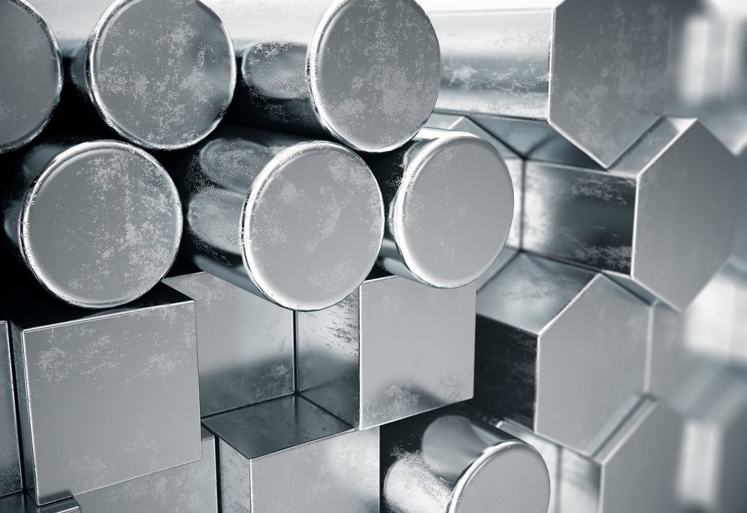 A stack of stainless steel tubes, representing raw materials in the stainless steel industry and asset services.
