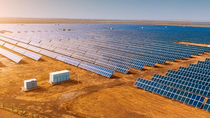 Solar panels stretching out onto a field