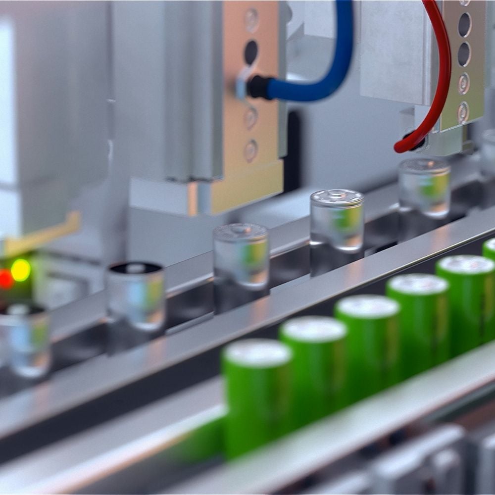 Image of green and silver batteries on the production line showcasing CRU's industry data and intelligence for the Battery Sector