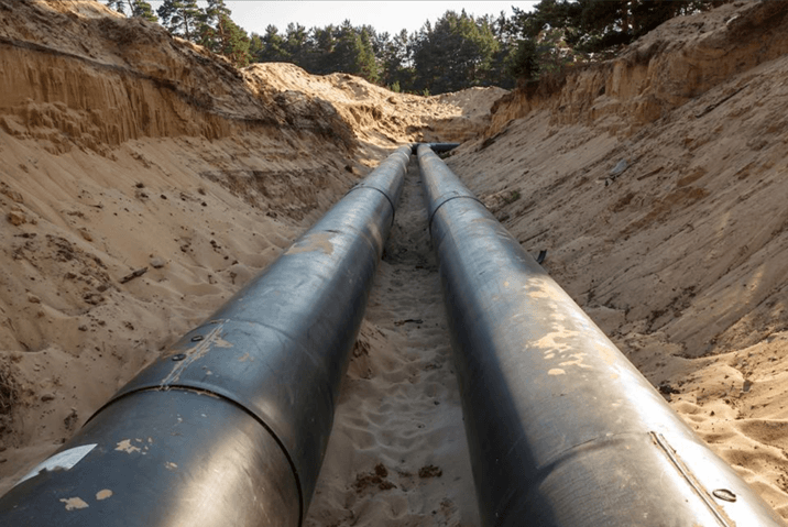 an-uncovered-pipeline-construction-site-with-sand-around-it