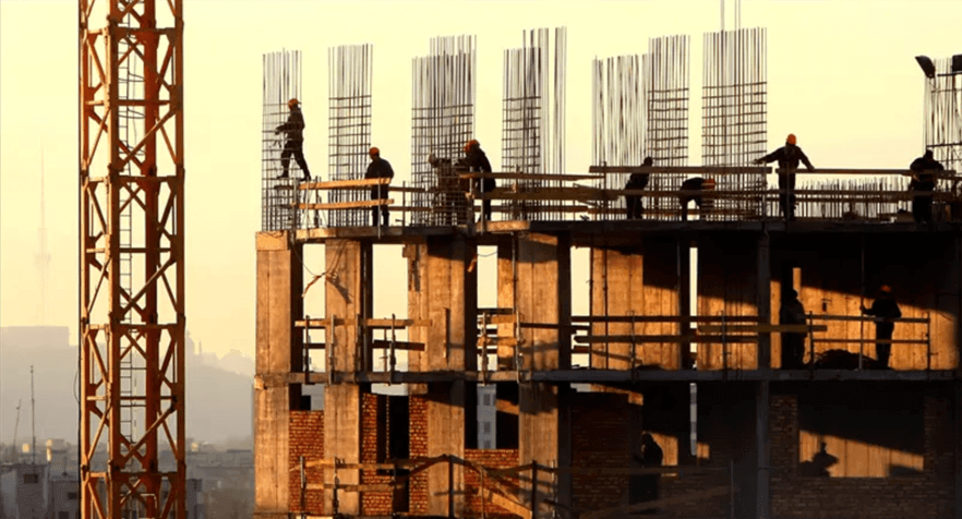 construction-workers-on-incomplete-site-with-a-sunset-in-the-background