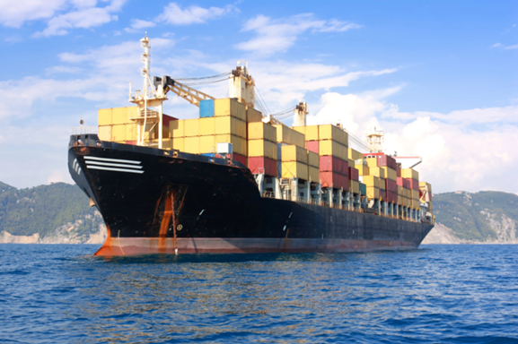 containers-cargo-ship-in-water-with-mountains-in-the-background